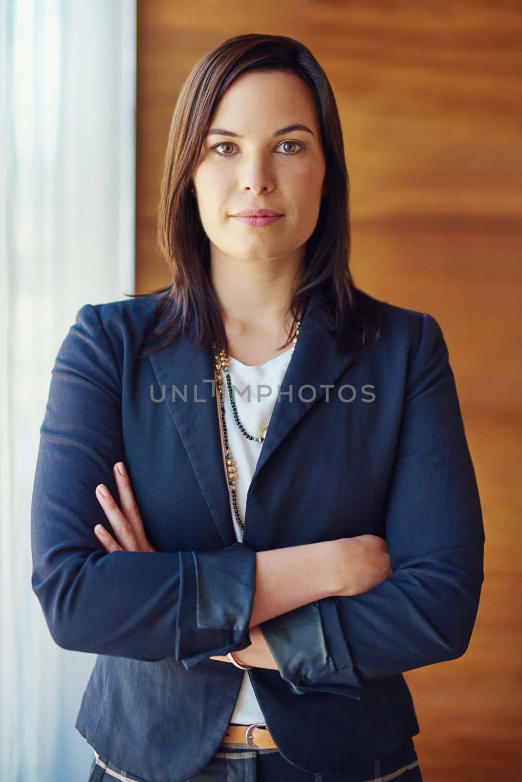 Onward and upward. Portrait of a confident businesswoman standing in her office