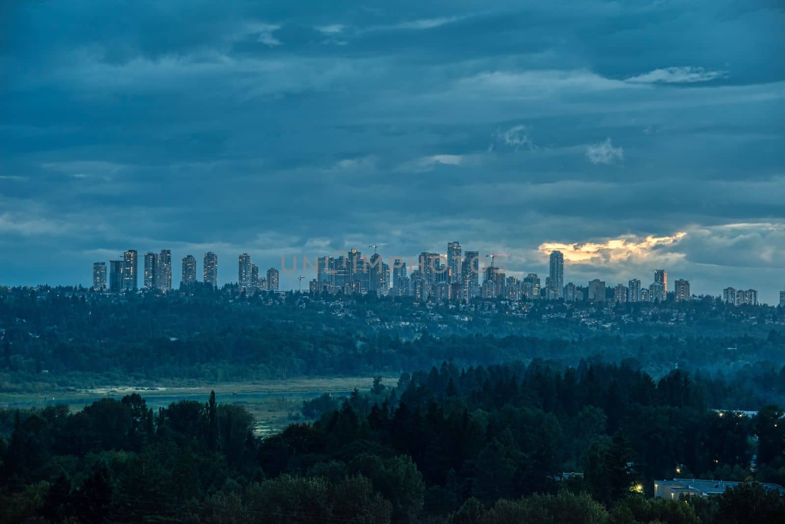 Overview of Metrotown cityscape on cloudy sky background by Imagenet