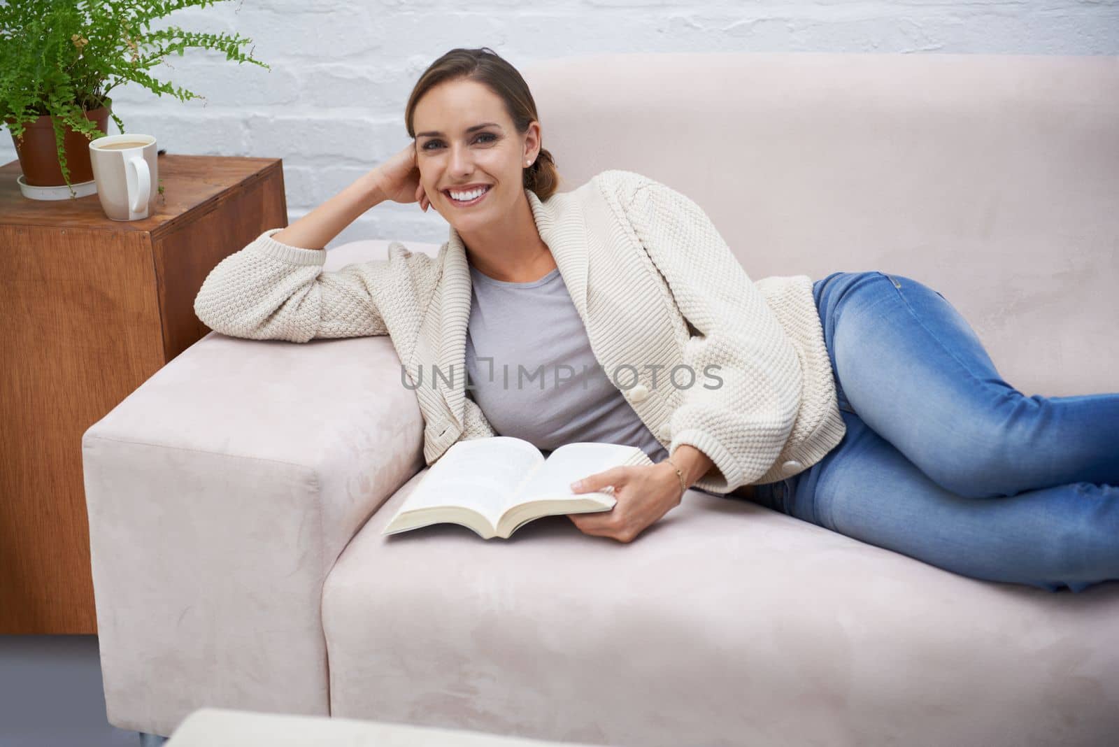 Making the most of her time off. an attractive young woman relaxing on the sofa at home