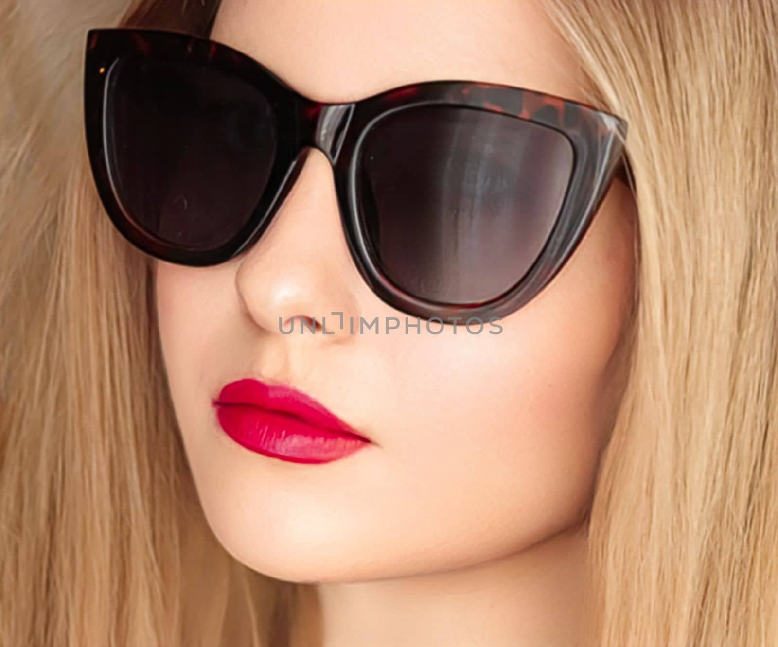 Beauty, fashion and style, face portrait of beautiful woman wearing stylish cat eye sunglasses and red lipstick make-up, luxury accessory and summer lifestyle, glamour and chic look.