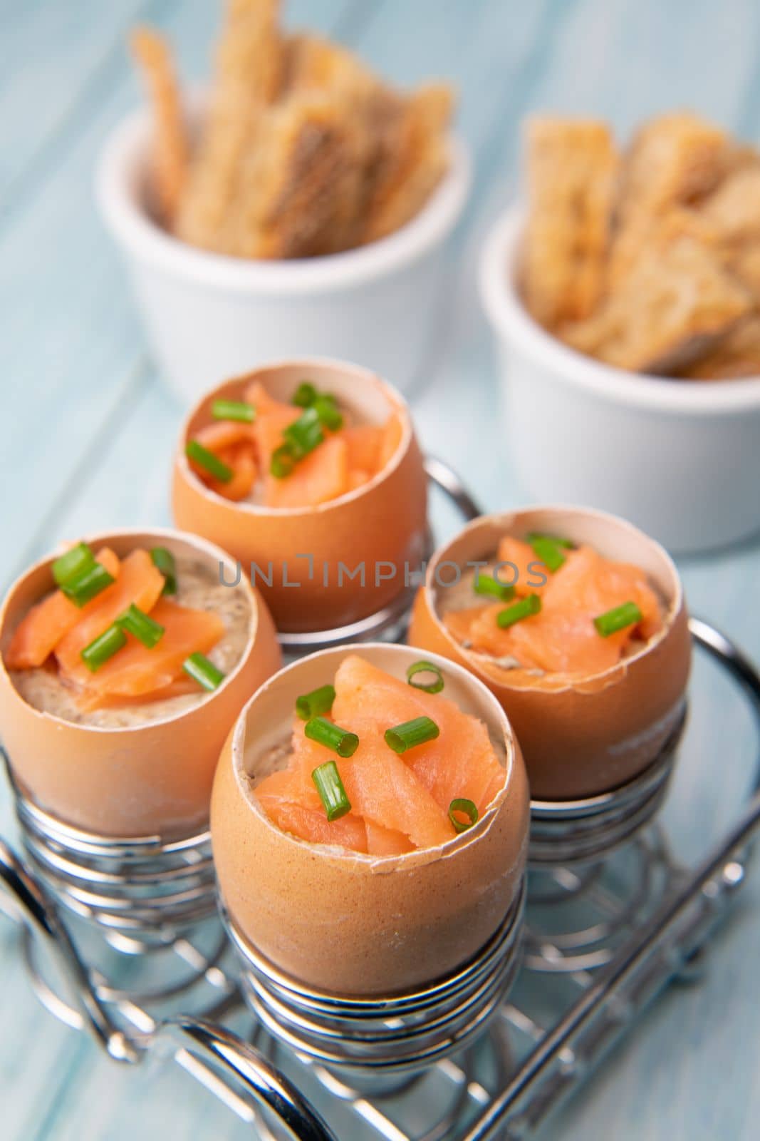 Recipe eggs casserole cooked in the shell with mushroom cream sauce and smoked salmon, High quality photo