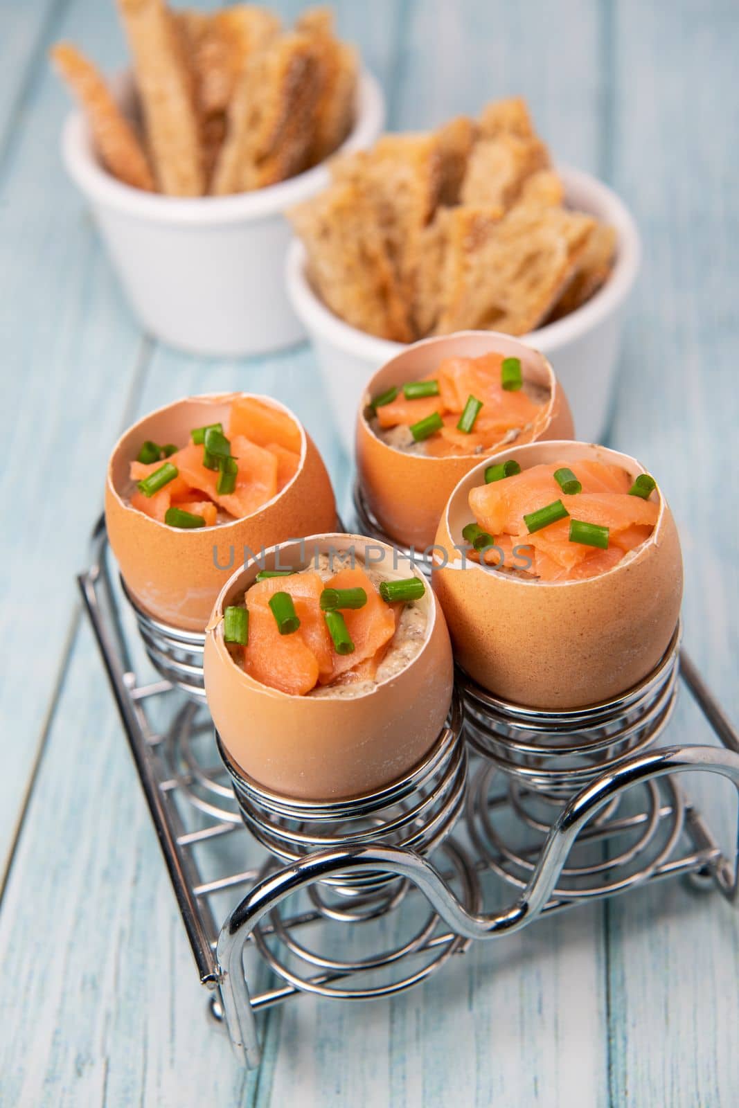 Recipe eggs casserole cooked in the shell with mushroom cream sauce and smoked salmon, High quality photo