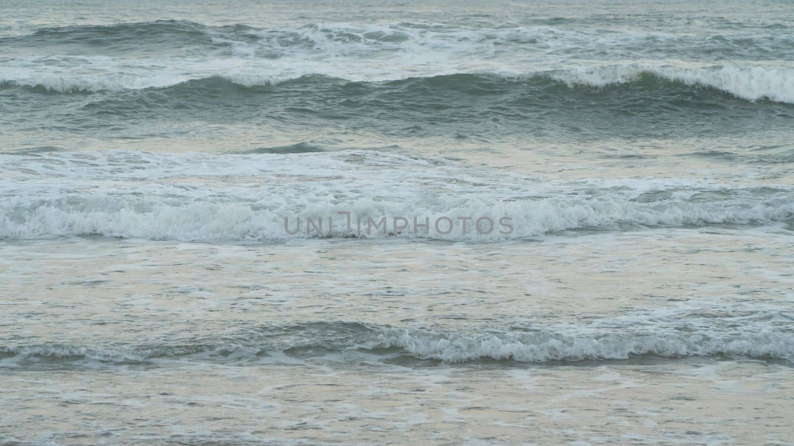 sea waves at sunset texture. High quality photo