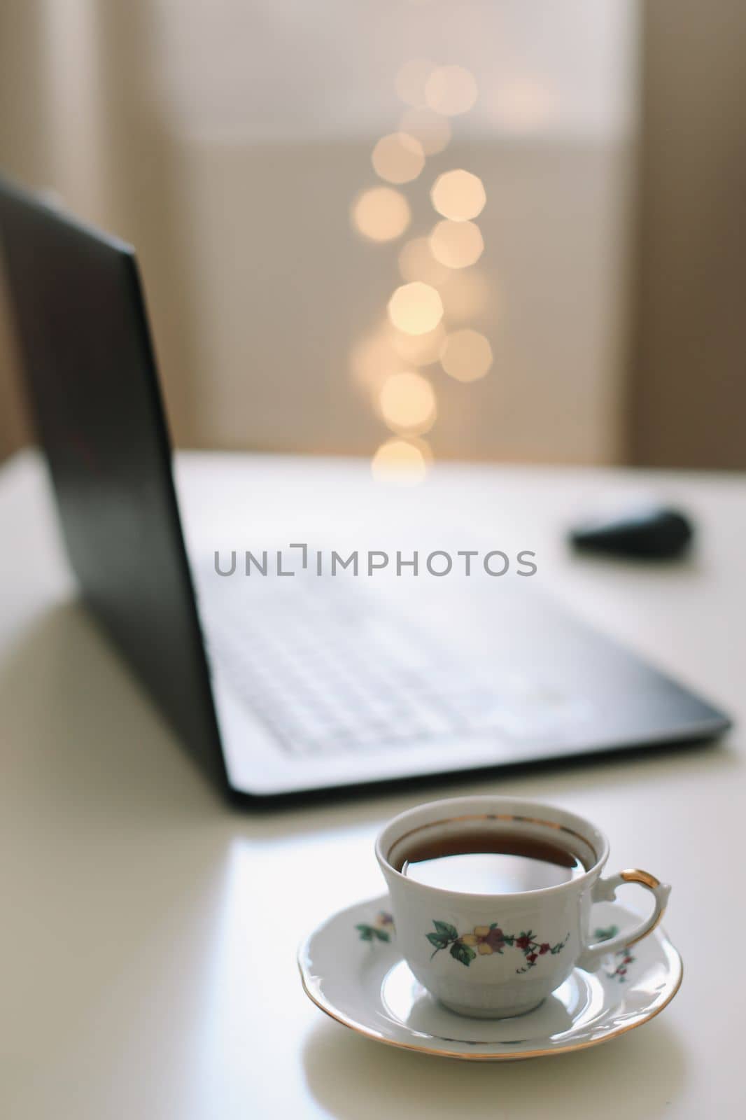 Freelance, working at home office, keyboard close up. Close up of laptop keyboard with blank screen