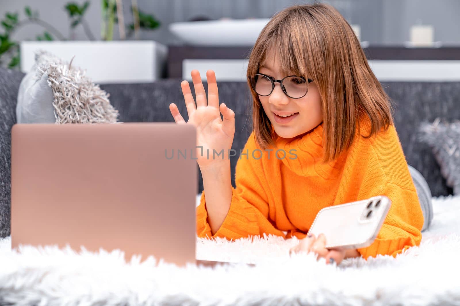 child communicates online at home with the help of modern technologies. High quality photo