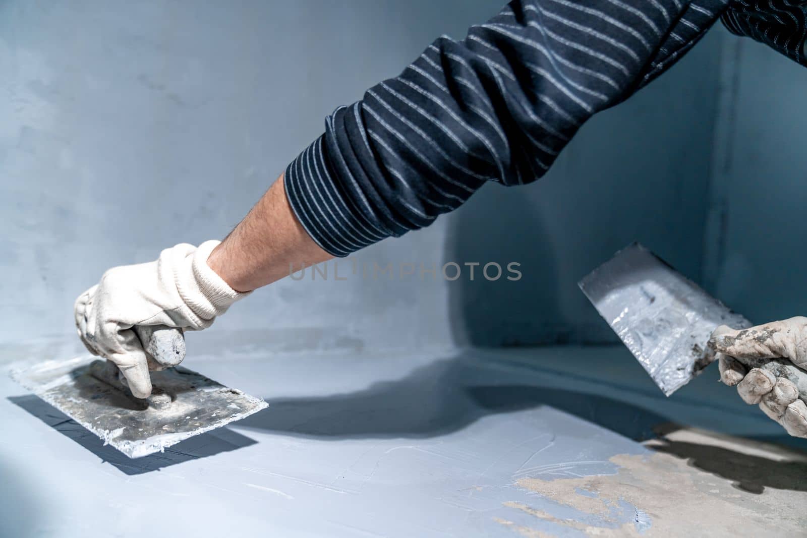 construction modifications of the floor and walls of a room in a new building. High quality photo