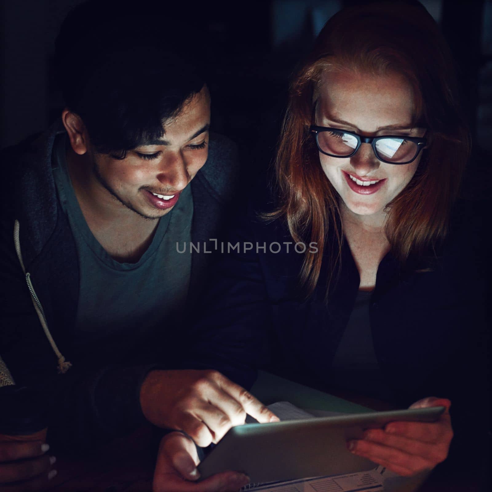 Teamwork, tablet and planning with people in office at night for research, web design and strategy. Creative, collaboration and technology with man and woman in startup for data, proposal and idea by YuriArcurs