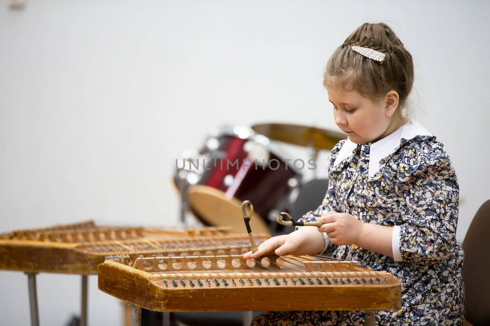 May 21, 2021 Belarus. city of Gomil. Holiday at the music school.The girl plays the ethnic instrument dulcimer