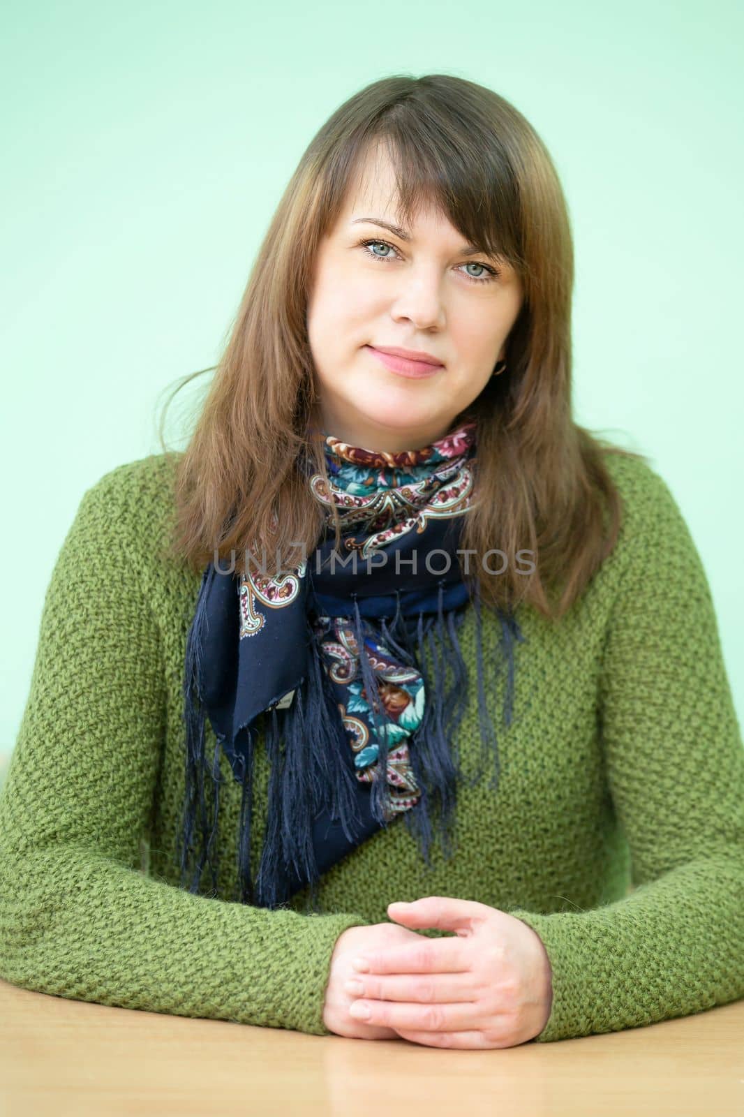 Belarus, Gomil city, December 31, 2021.Secondary school.Vertical portrait of a middle-aged woman. by Sviatlana