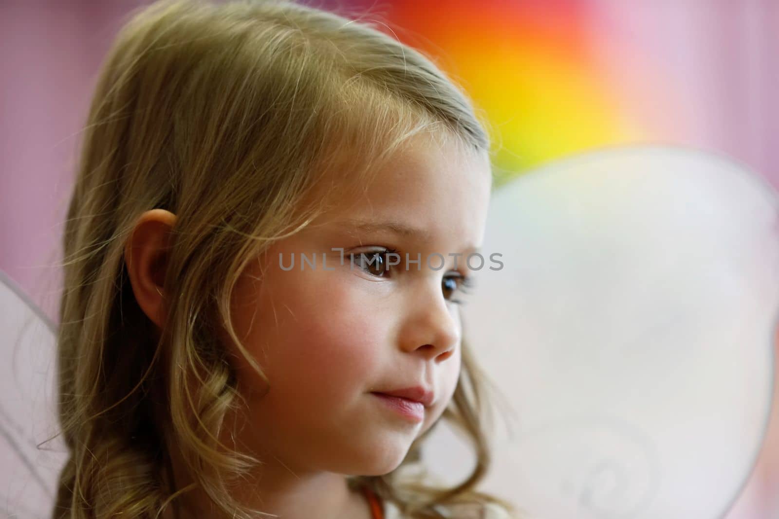 Belarus, city of Gomil, May 16, 2019. Morning in kindergarten.Close-up portrait of a little six-year-old girl. by Sviatlana