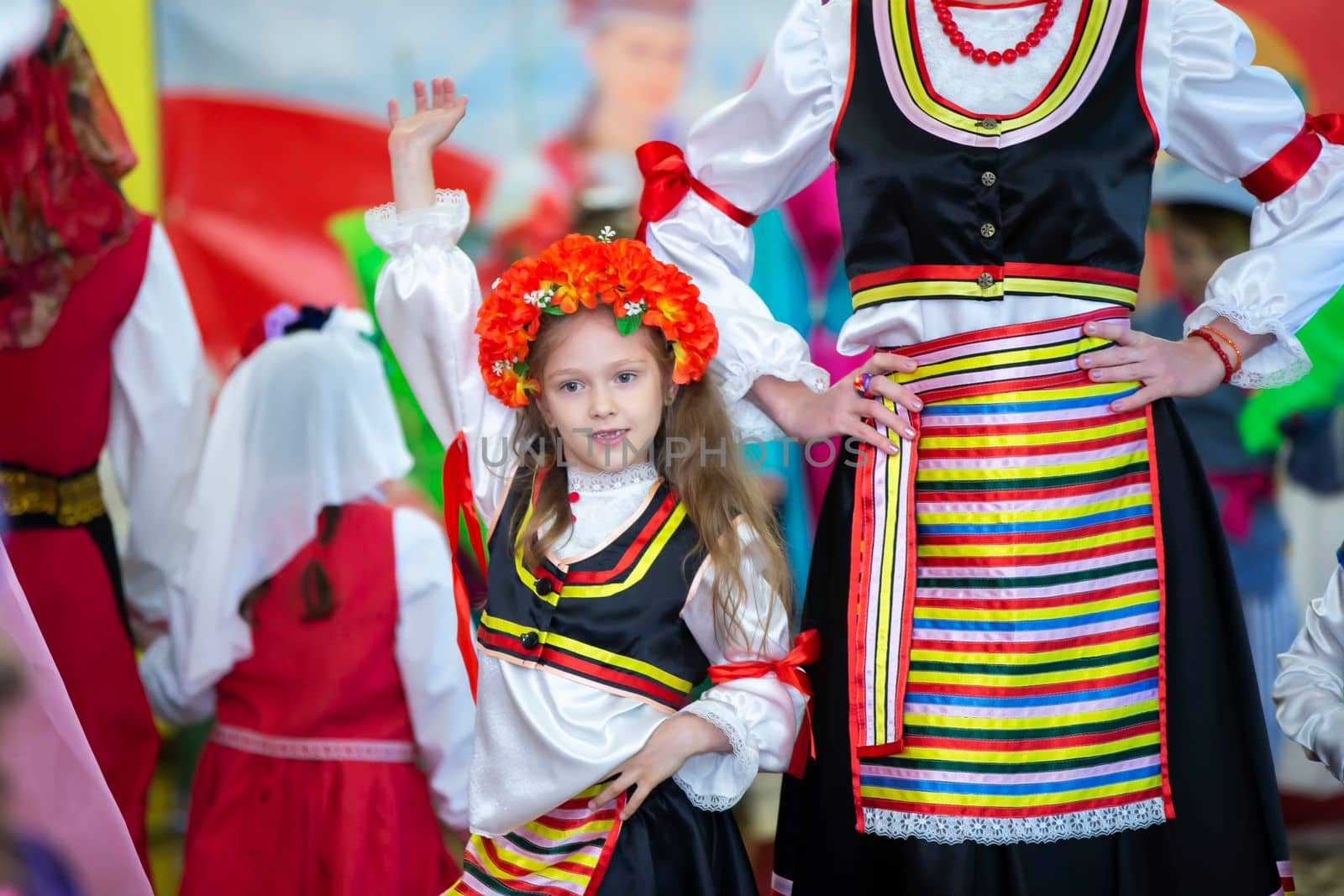 Belarus, city of Gomel, May 21, 2021 Children's holiday in the city. A little girl in a Ukrainian costume is dancing.