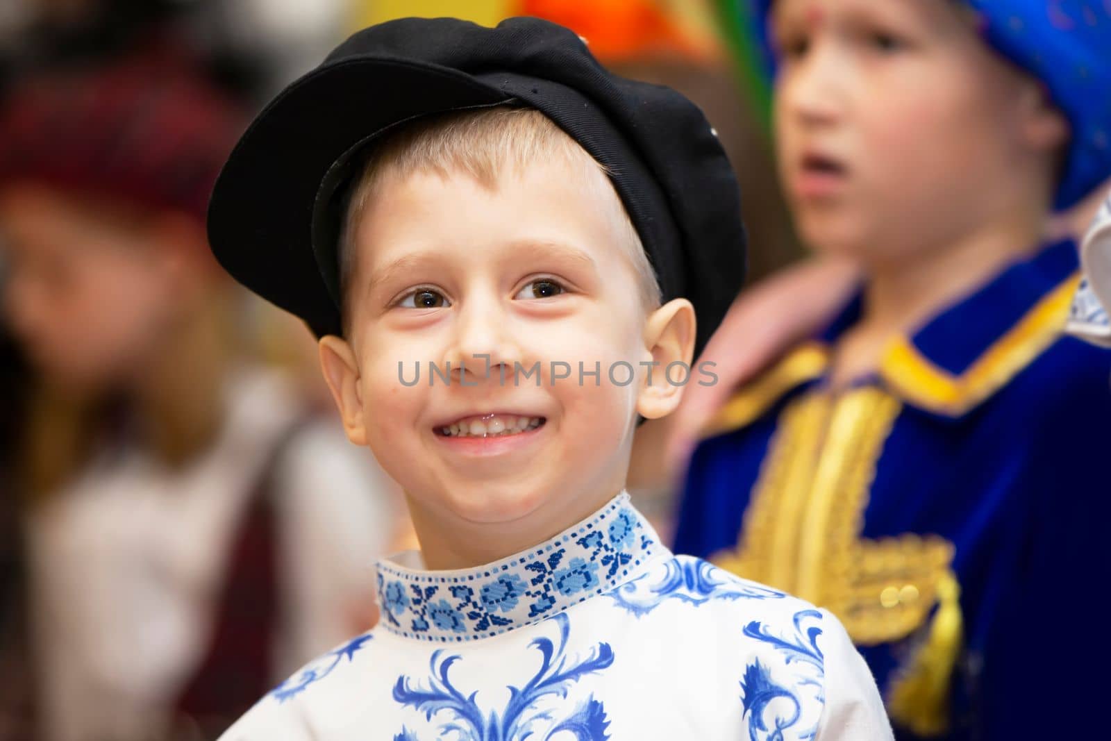 Belarus, city of Gomel, May 21, 2021 Children's holiday in the city. Little boy in Russian national costume and headdress.