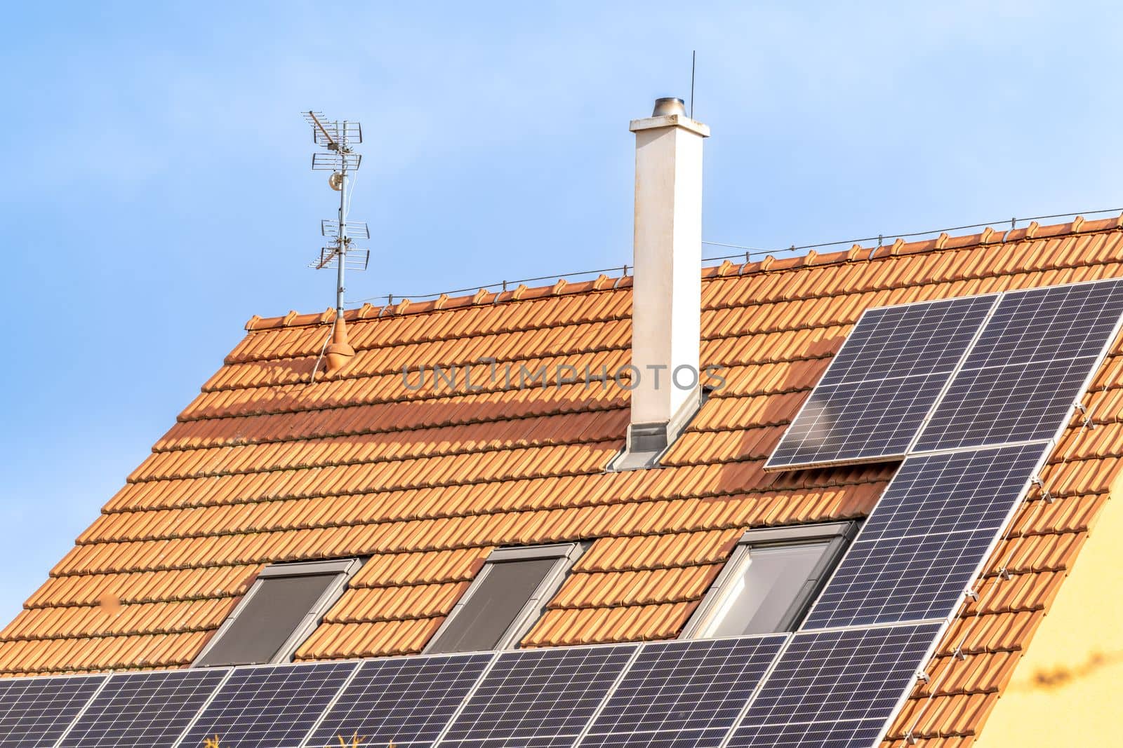 solar panels for the production of electricity from the sun on the roof of a family house. High quality photo