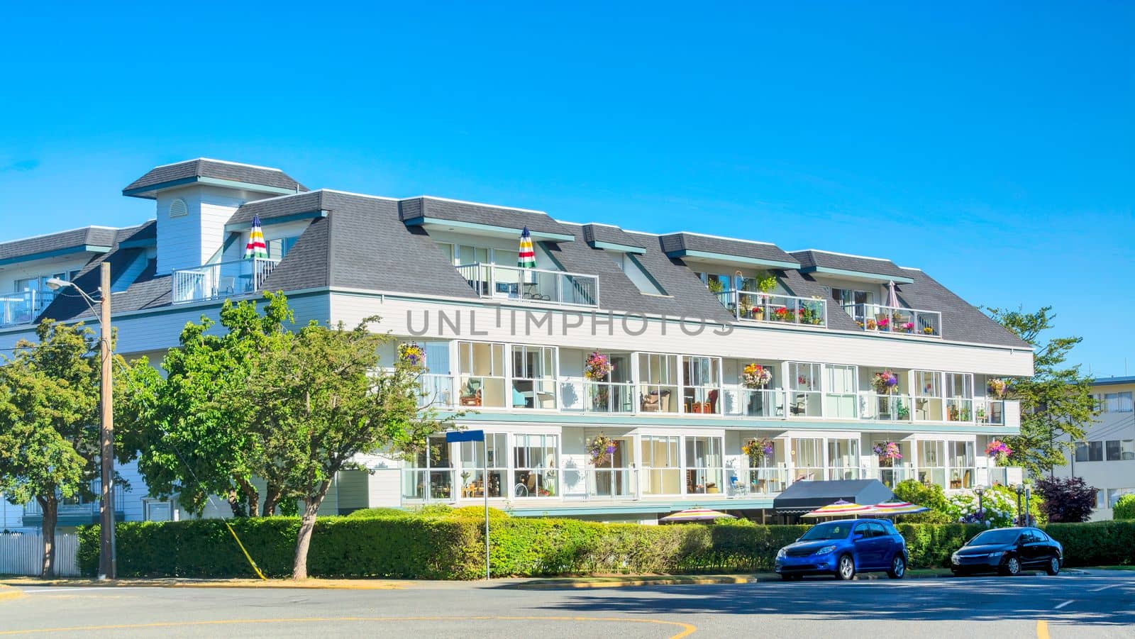 Street view with nice residential building in resort area of Victoria, British Columbia