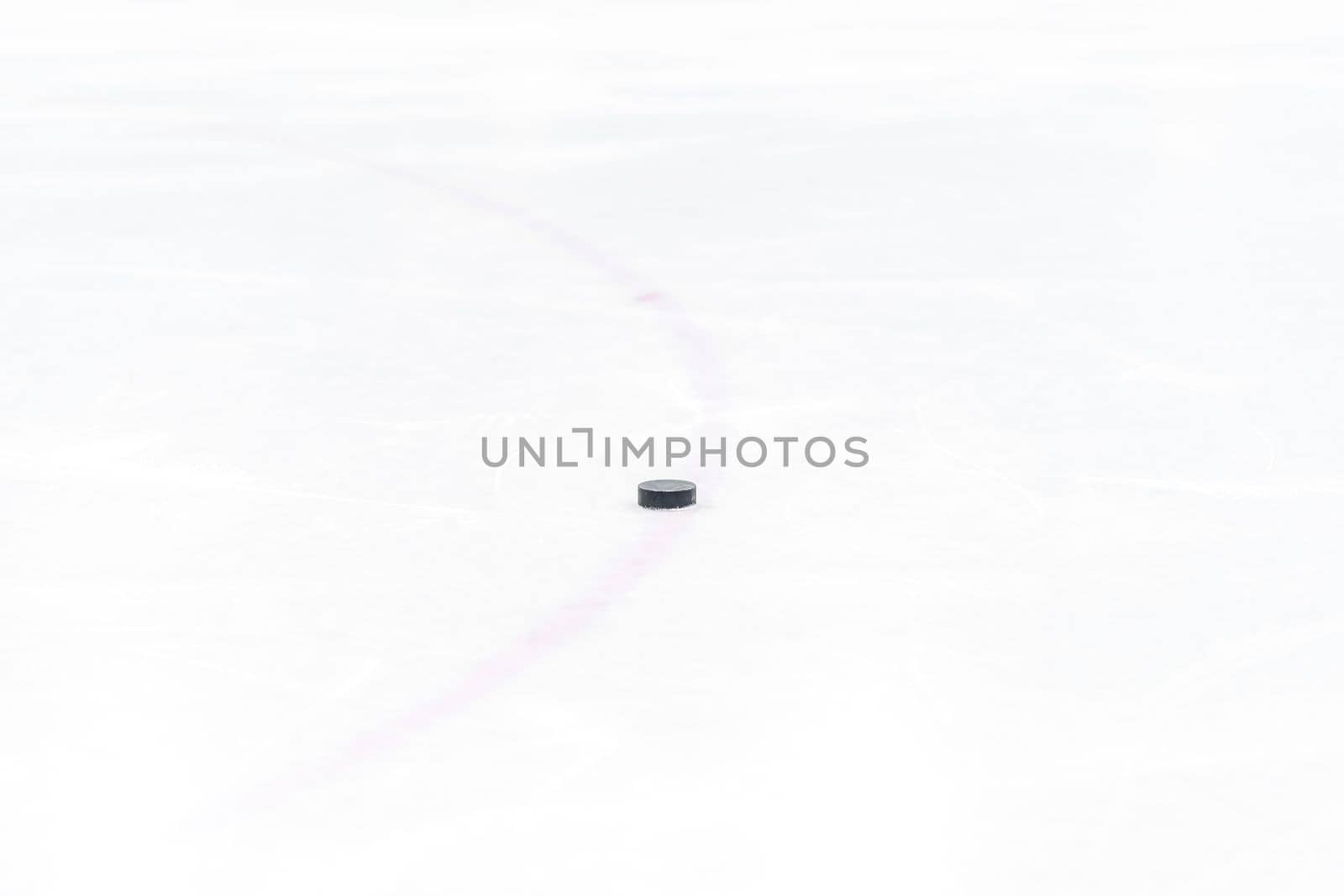 hockey puck on the ice of the winter stadium. High quality photo