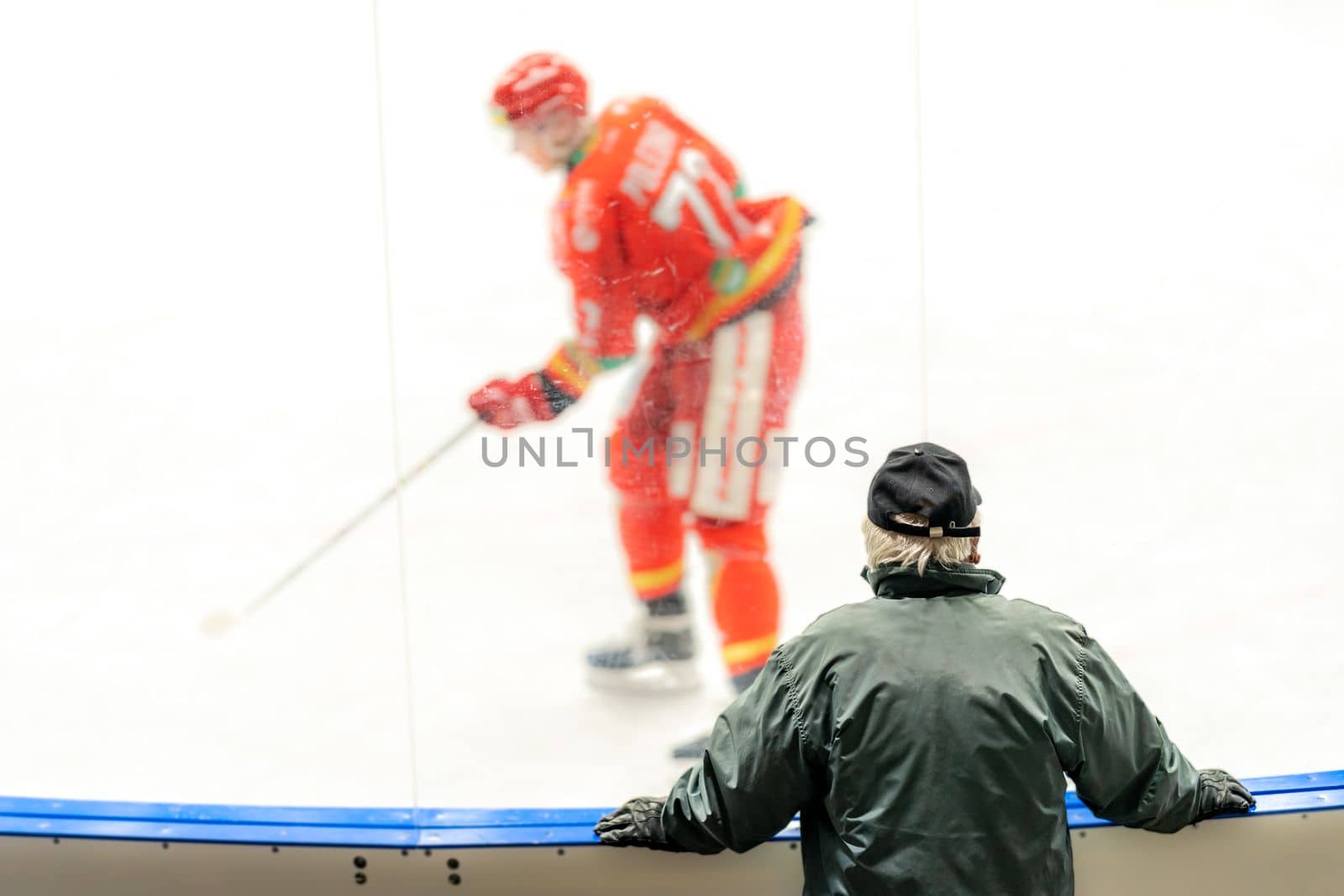 a spectator at a game in a hockey stadium. High quality photo