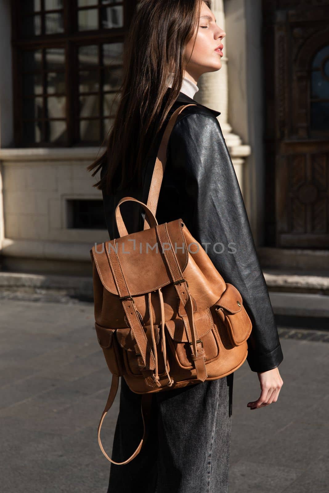 photo of a brown, retro look leather backpack by Ashtray25