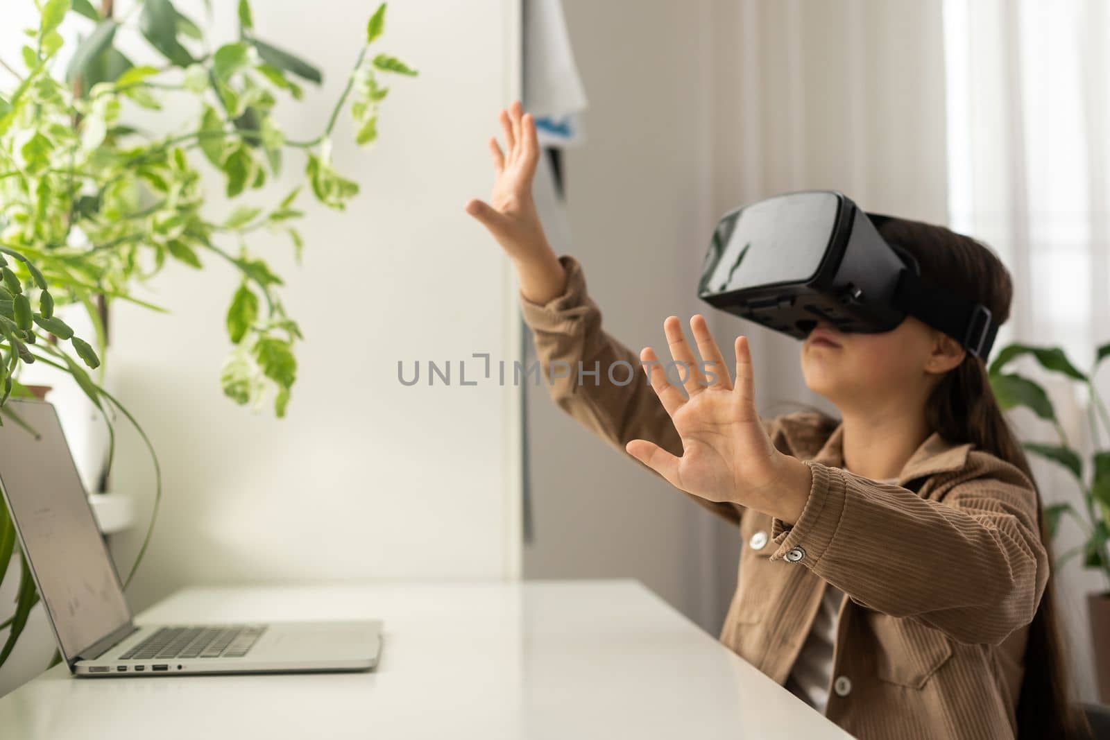 teenage schoolgirls using virtual reality headsets.