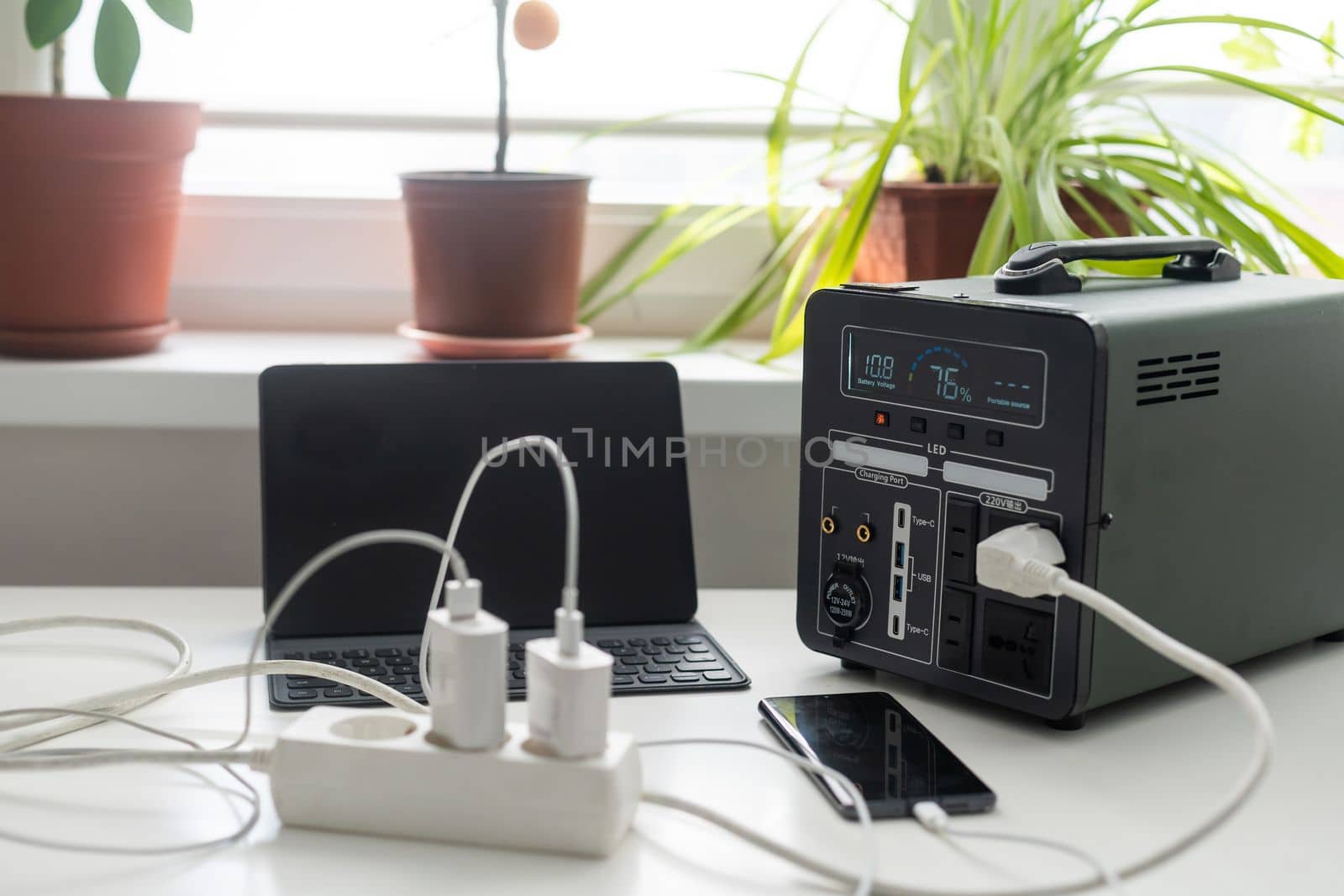 portable charging station charges gadgets by Andelov13
