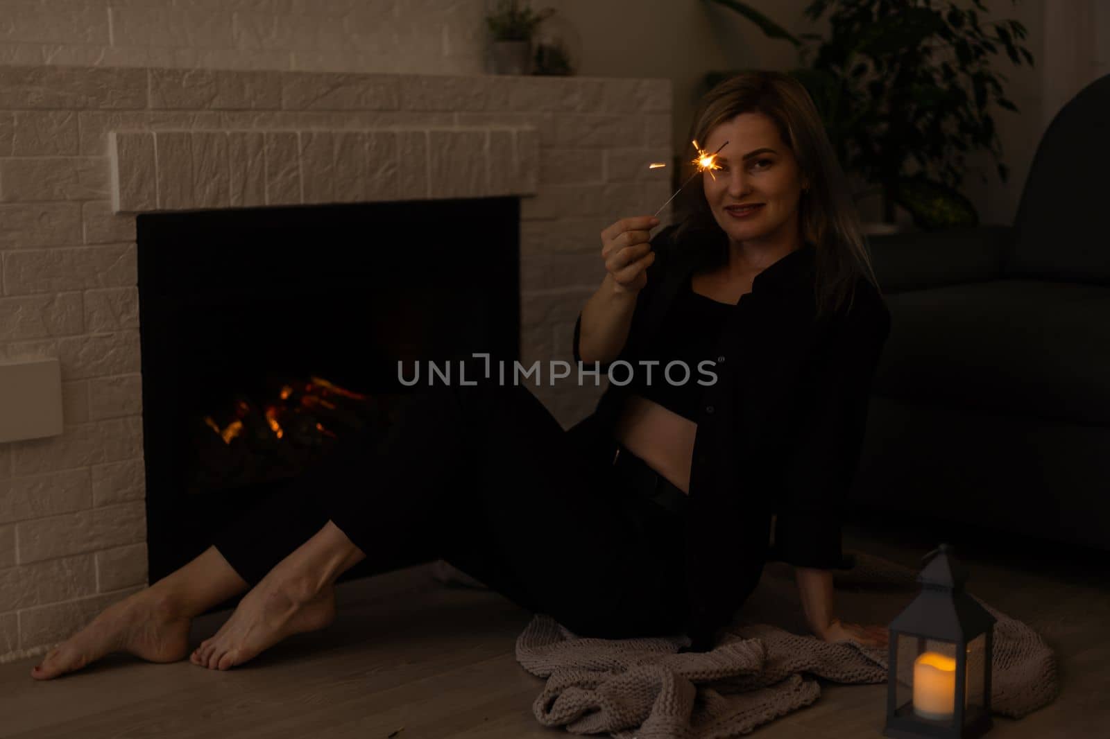 woman by the fireplace