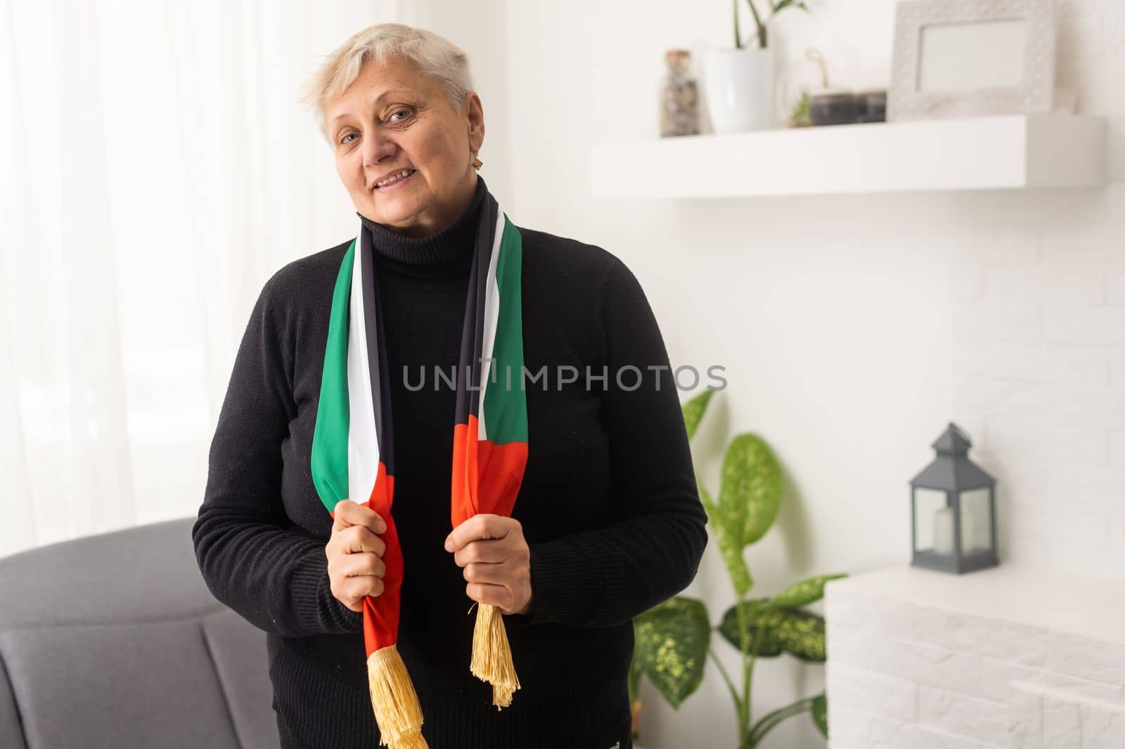 old woman with UAE flag.