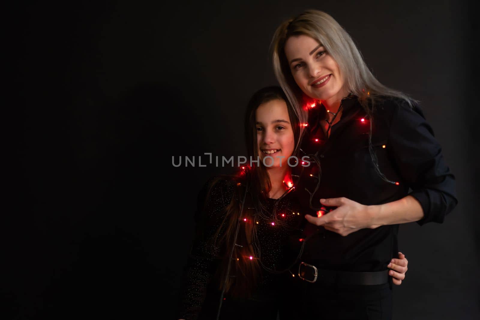 happy Christmas. family mother and kid with Christmas garland by Andelov13