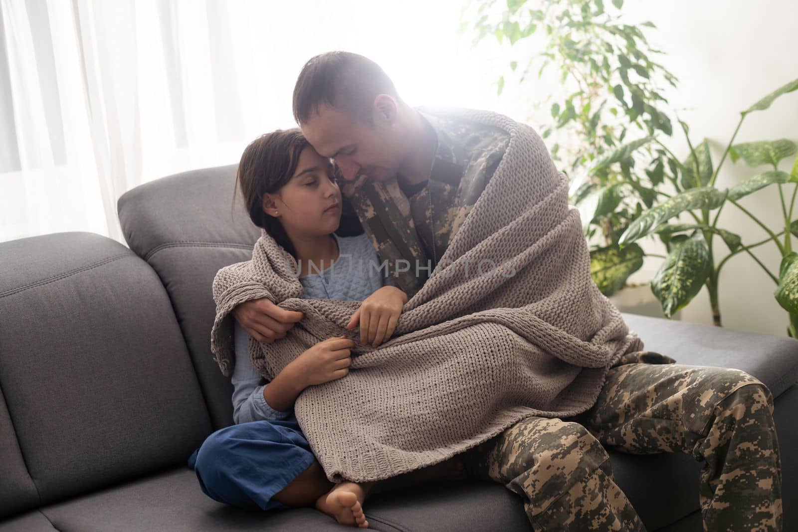 pretty little girl hugging her military father. by Andelov13