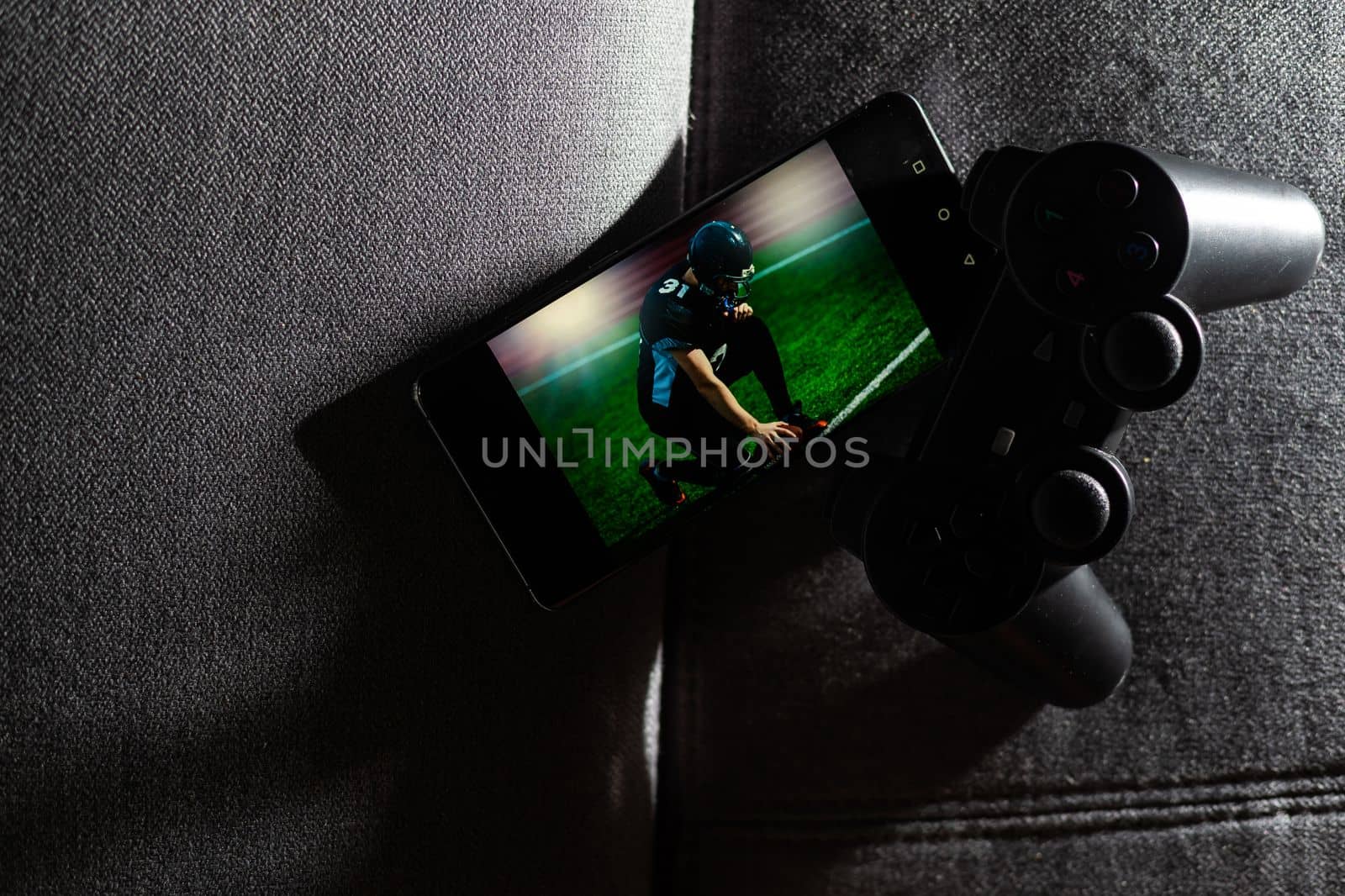 Smartphone and two game joysticks. Minimalism. Cybersport concept. Streaming. by Andelov13