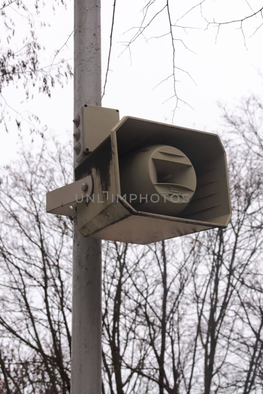 Speaker on a pole in the park close up