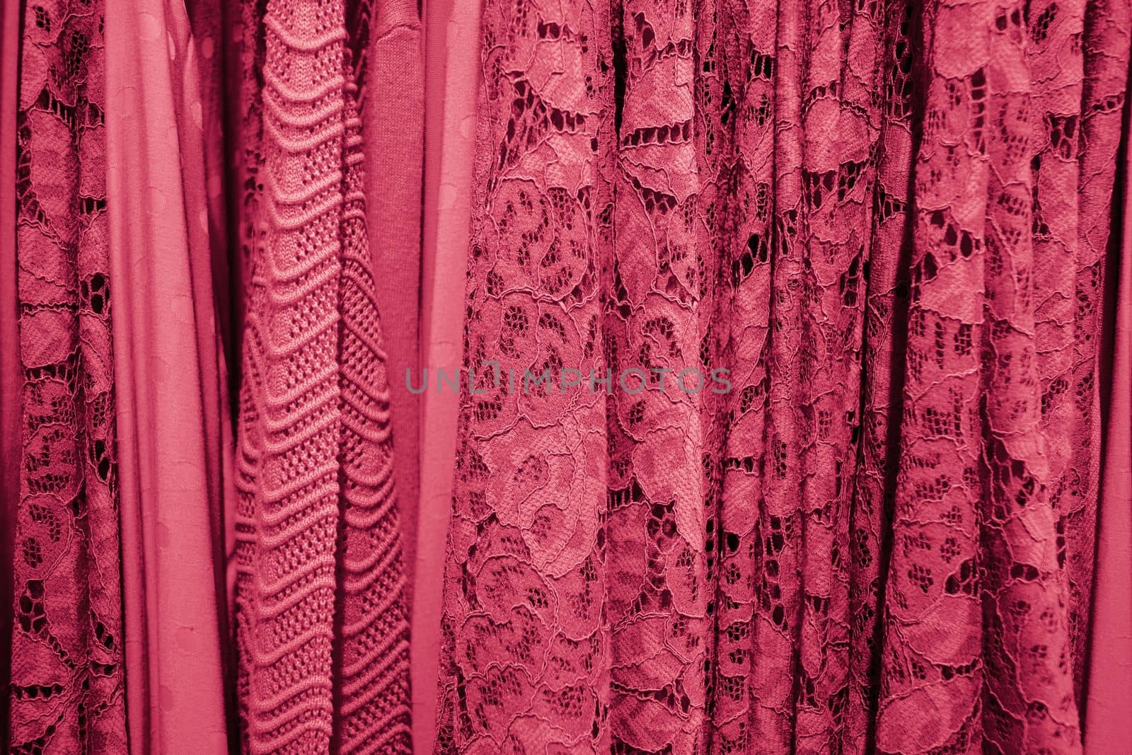 summer blouses on a hanger in the store, concept color of the year 2023 Viva Magenta, High quality photo