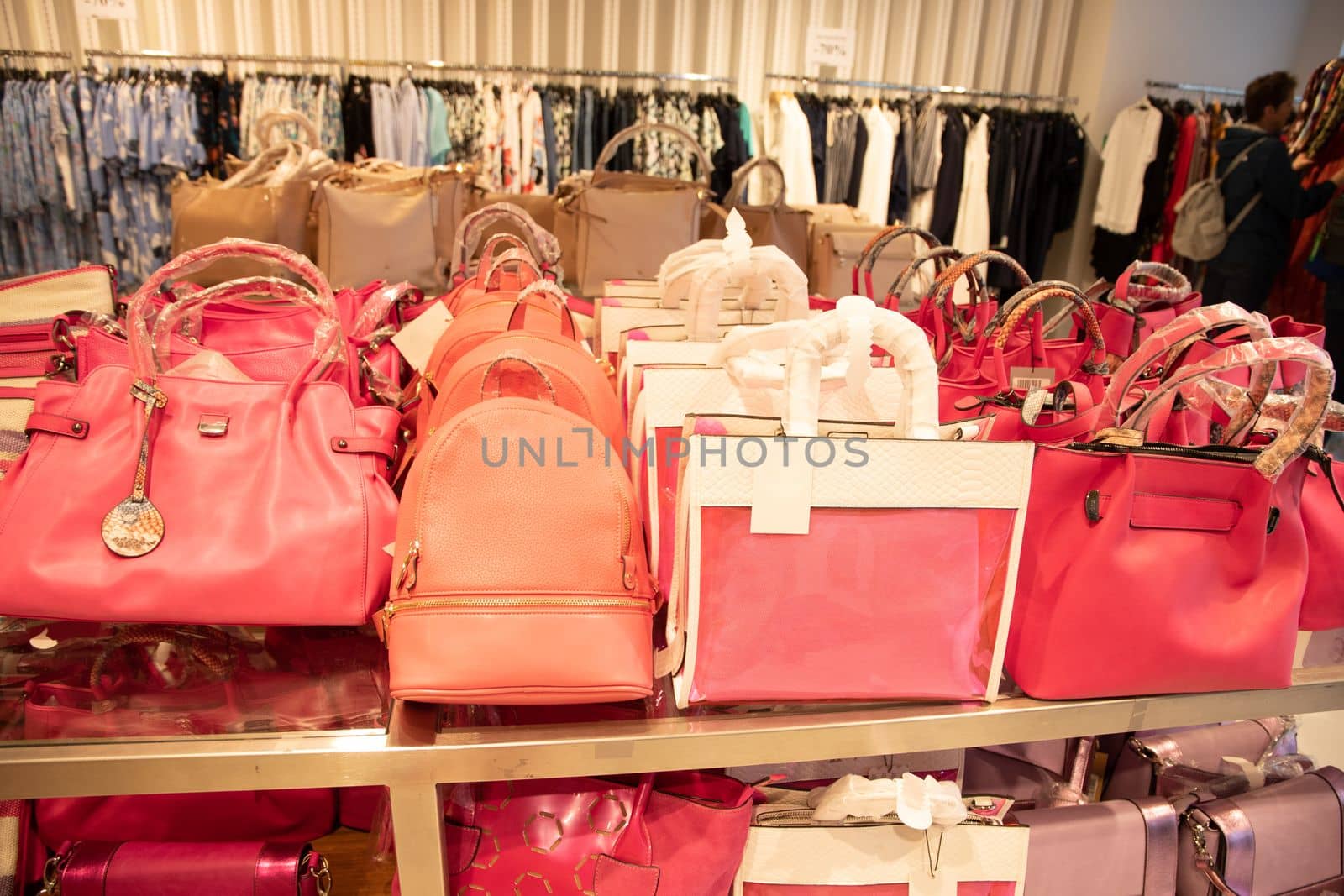 variety bag collection in store on counter pink magenta trendy pantone color of the year magenta. High quality photo