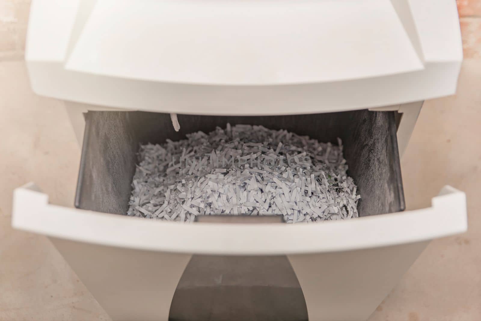 Industrial paper shredder. Paper shredder in the office, use and maintenance of professional office equipment. by SERSOL