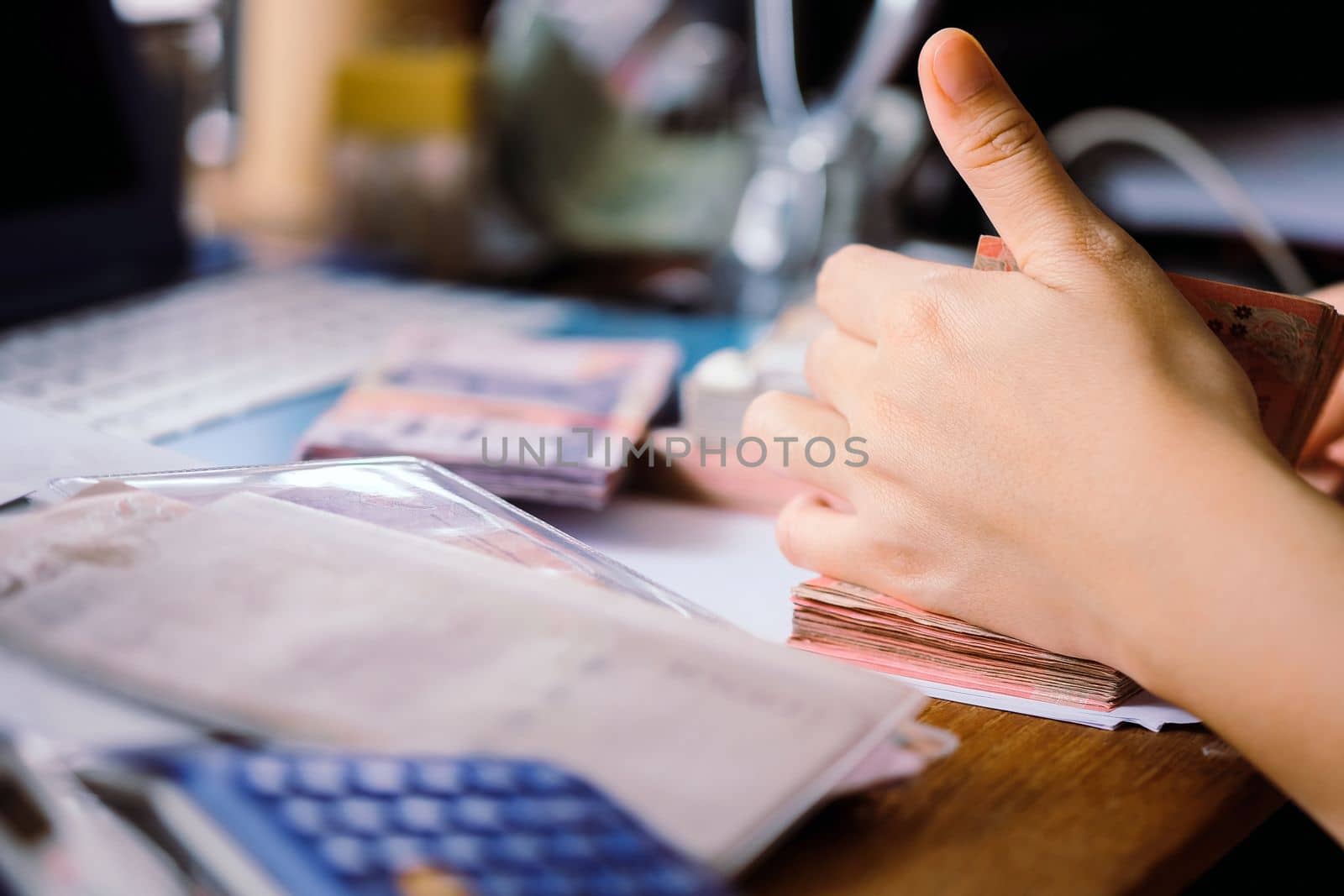 close up image of female hand count the money, business accounting background