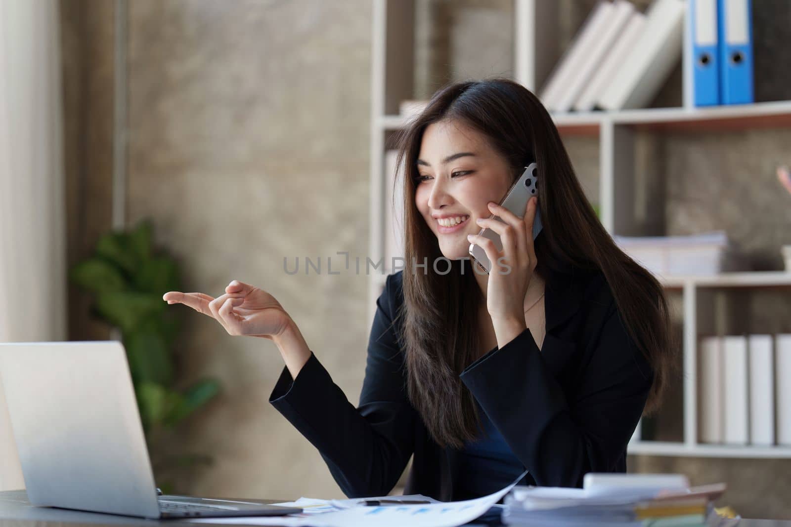 Beautiful business woman talking on the mobile phone. Management, planning and networking phone call concept.