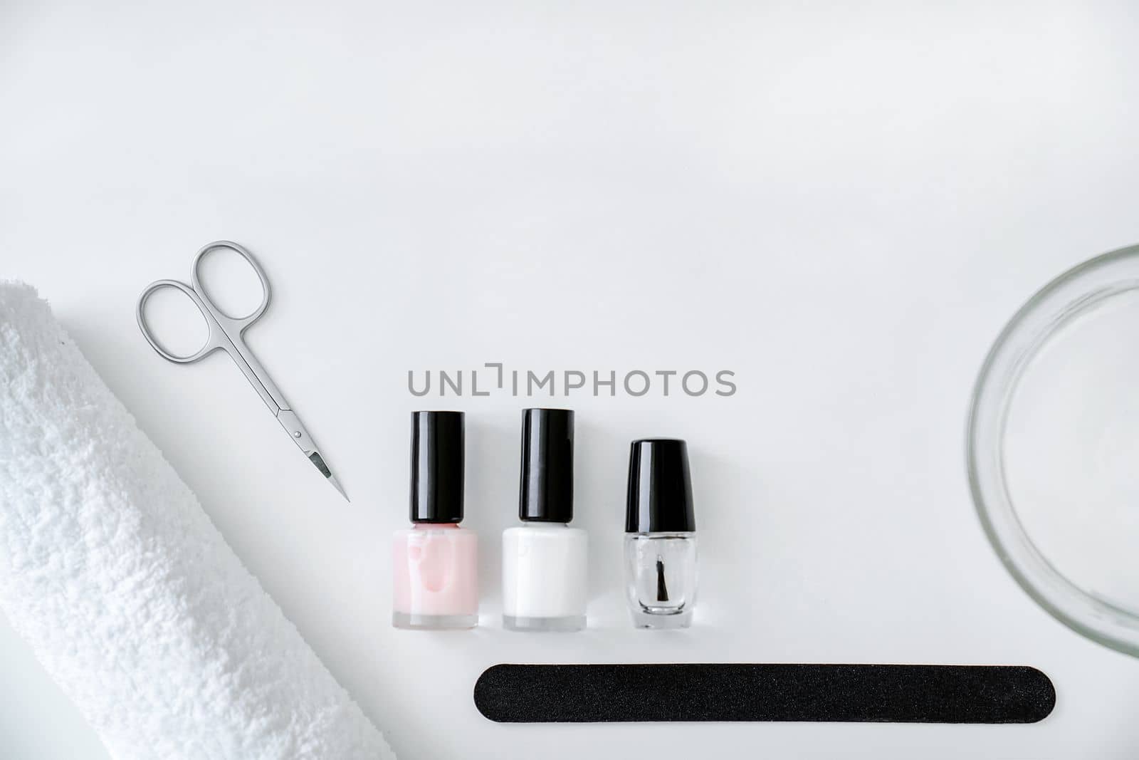 Set of accessories for manicure and hand care on white background, flat lay, top view, copy space