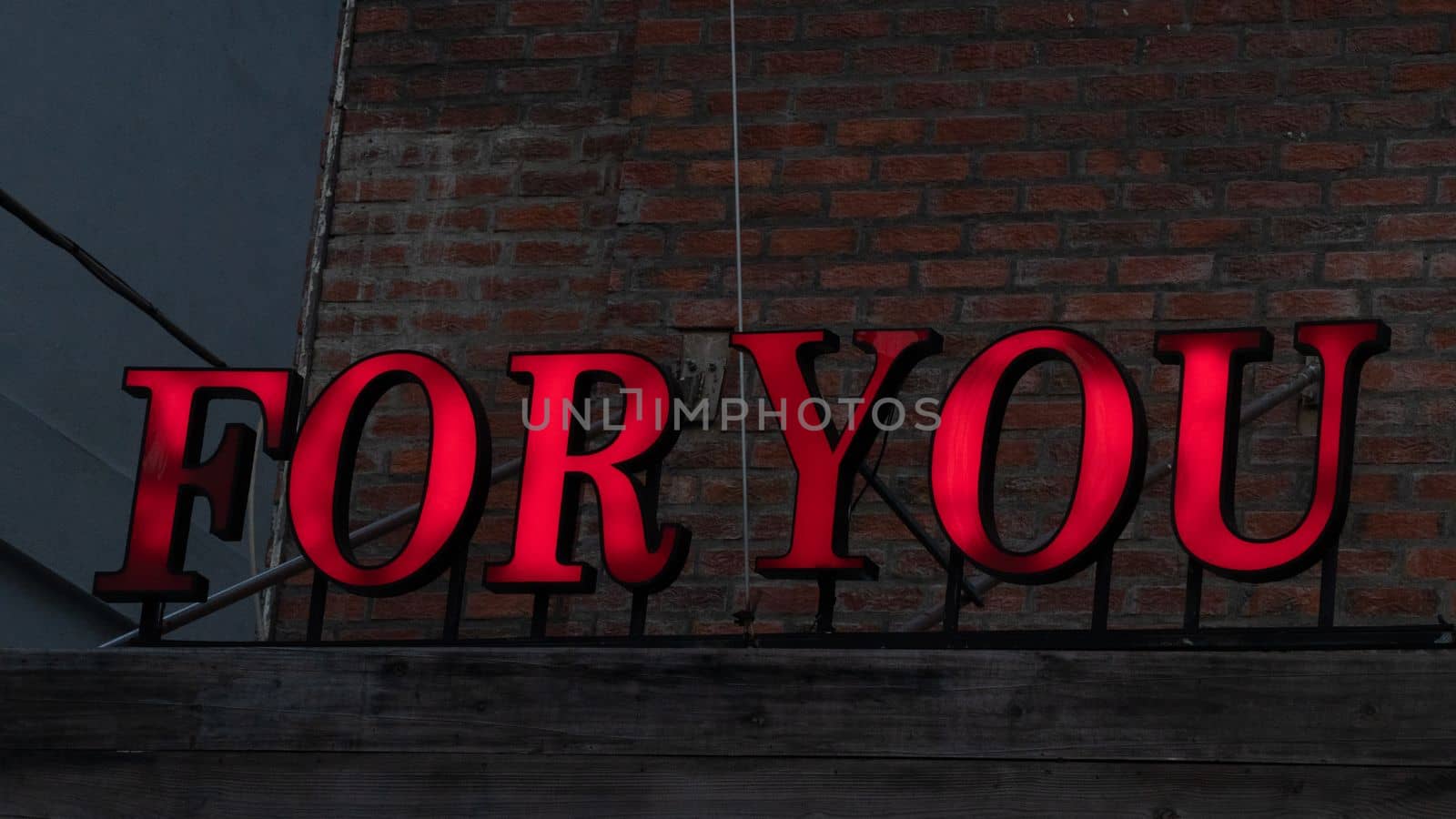 Red lettering for you sign against a brick wall loft style. High quality photo
