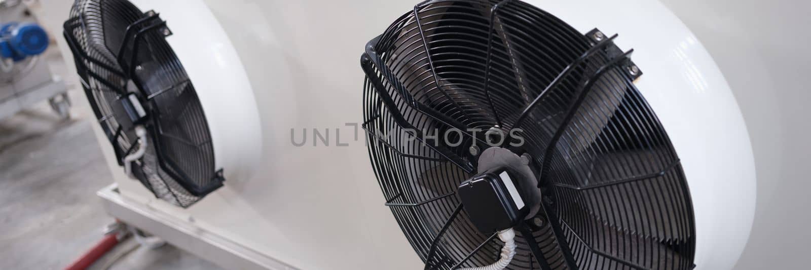 Industrial fans for large air conditioner in production room. Operation of ventilation equipment concept