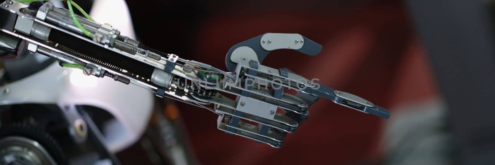 Robot hand pointing with index finger and touching gesture. Modern robotics and robot assistant