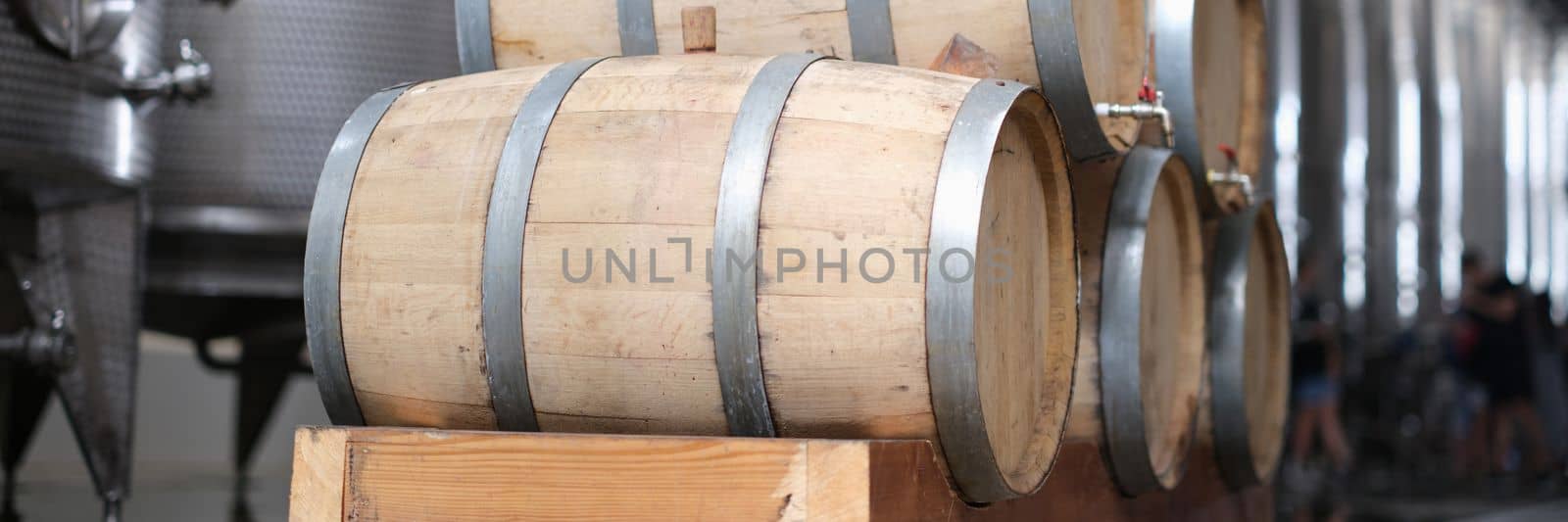 Wine production and modern wine tanks with wine barrels. Wine production plant concept