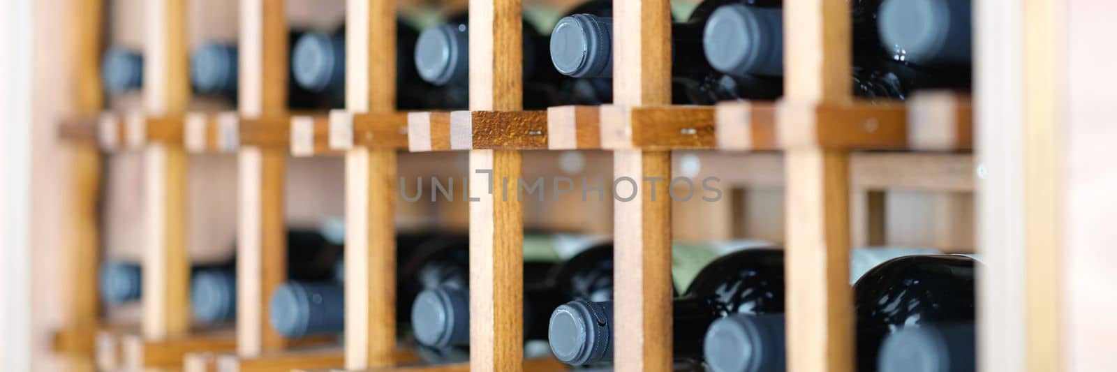 Homemade wine cellar with wooden boxes for storing bottles by kuprevich