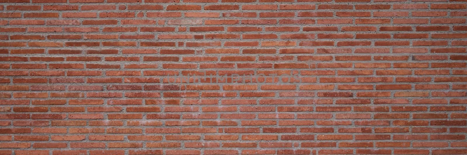 Texture of the wall of thin long red bricks. Brick background of old wall