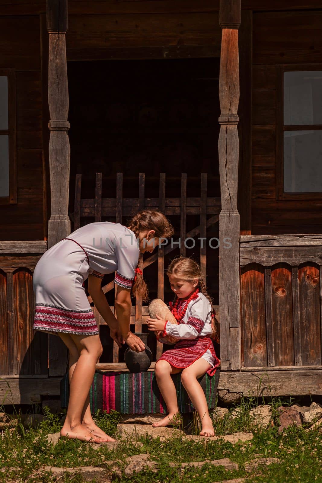 mother and daughter in Ukrainian folk dresses by zokov