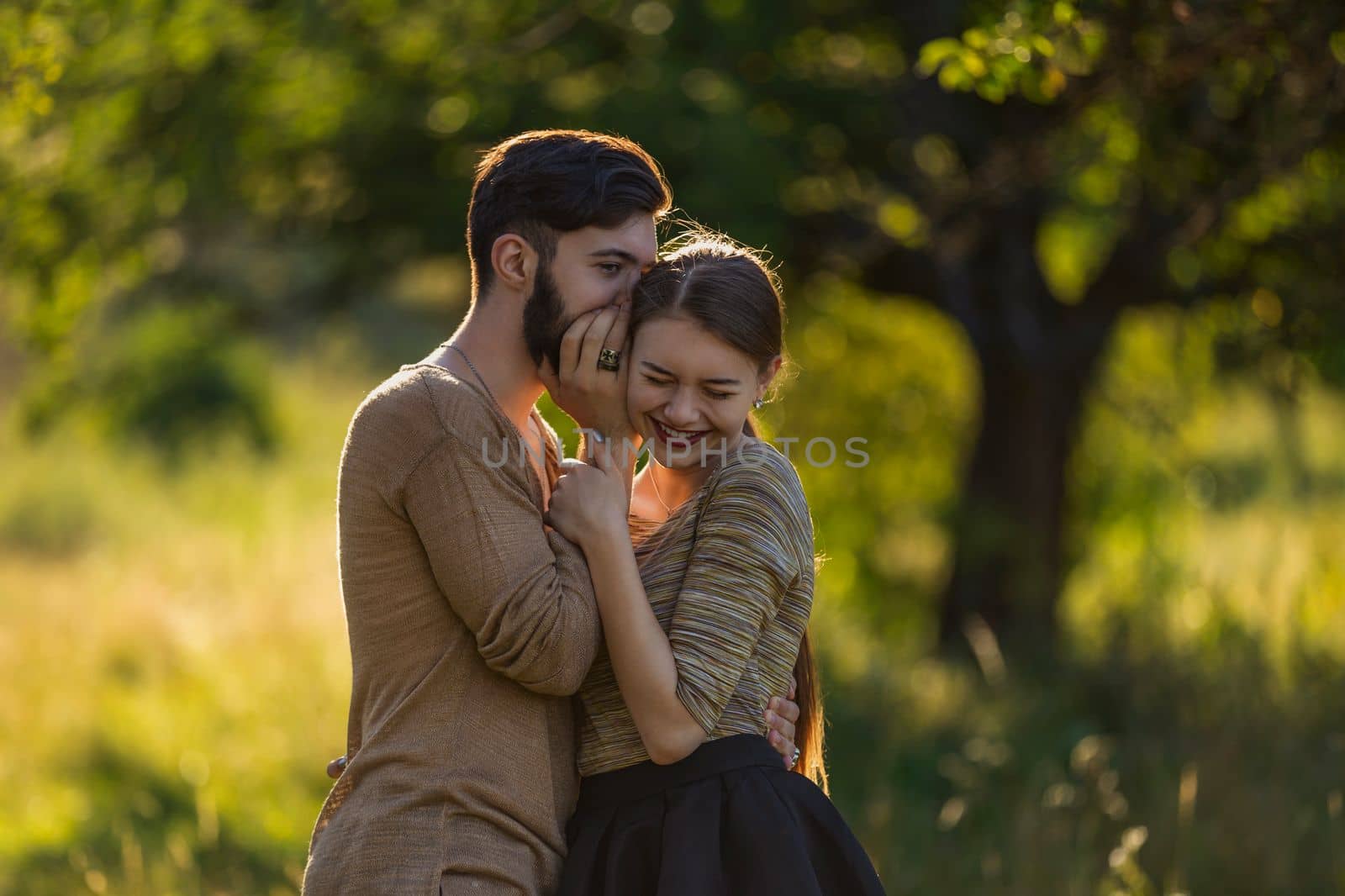 man telling his girlfriend's secret in his ear by zokov