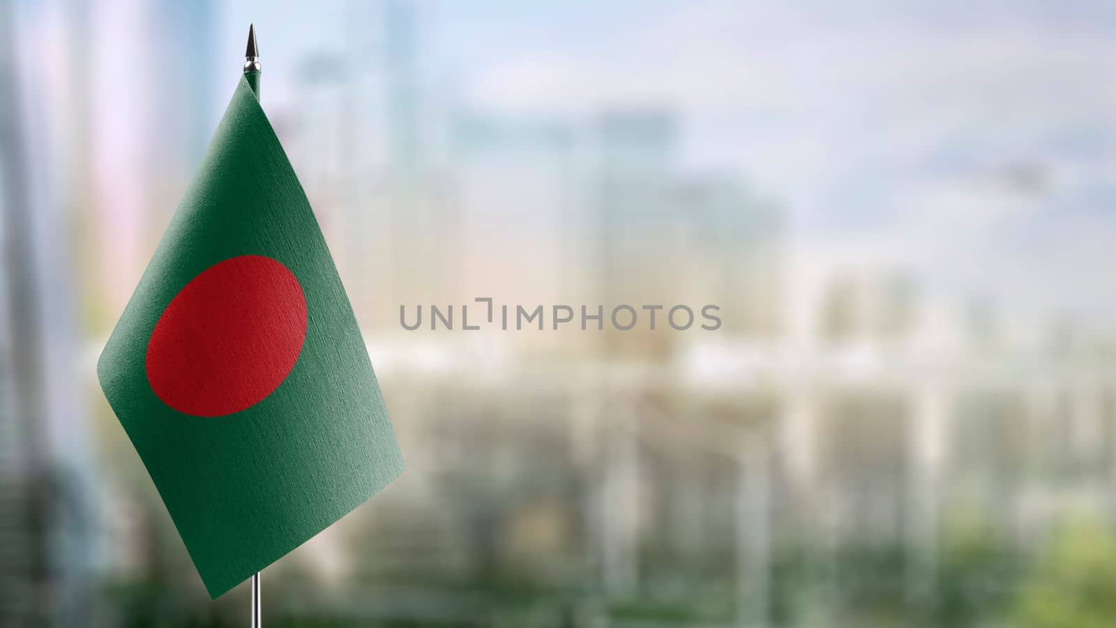 Small flags of the Bangladesh on an abstract blurry background by butenkow