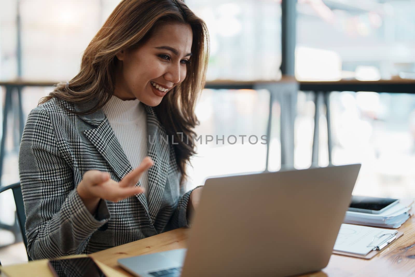 Business work and planning, portrait of a businesswoman using a computer in a meeting by Manastrong