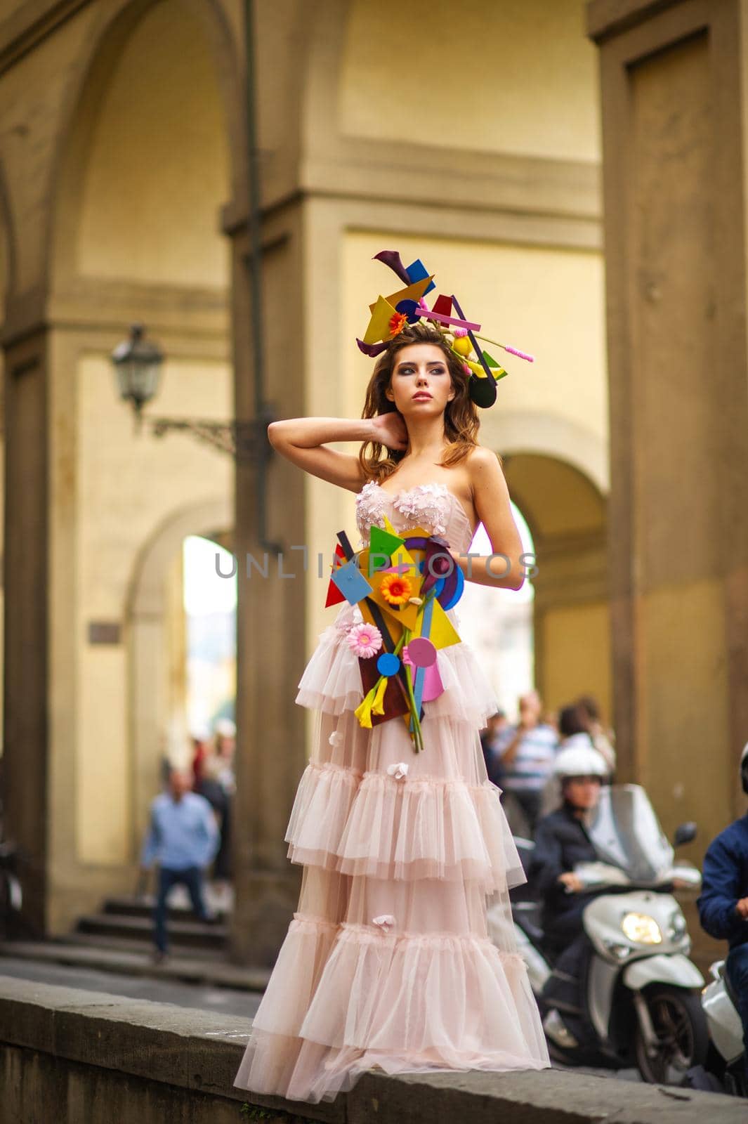 a bride in a pink wedding dress with an unusual bouquet and decoration in Gorova in Florence, Italy by Lobachad