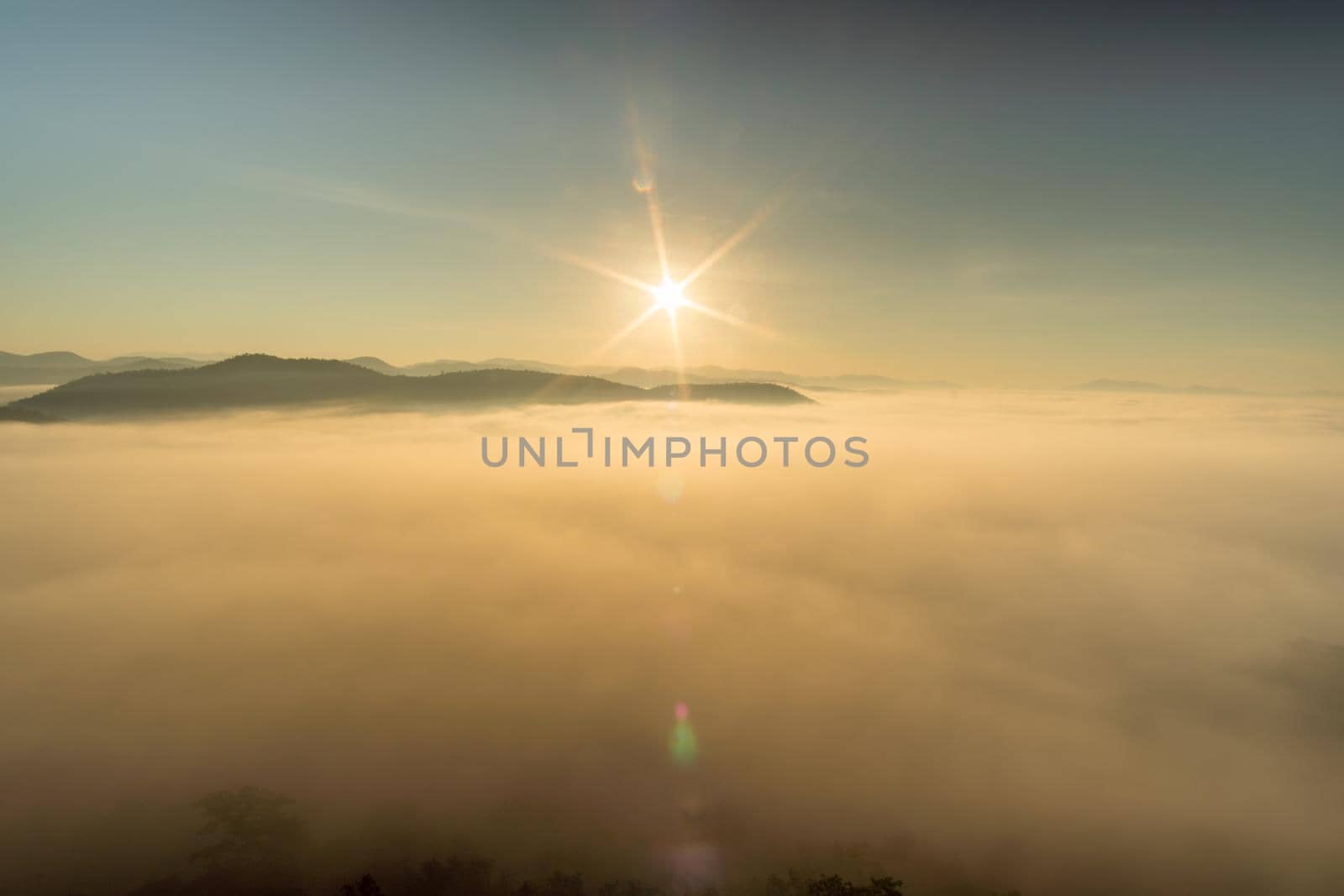 Morning fog covers Lamphun, Thailand, view from the viewpoint of Wat Phra That Pha Temple