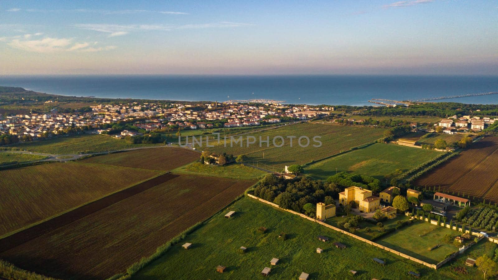 Top view of the old yellow villa in the Tuscan region and the fields.Italy.