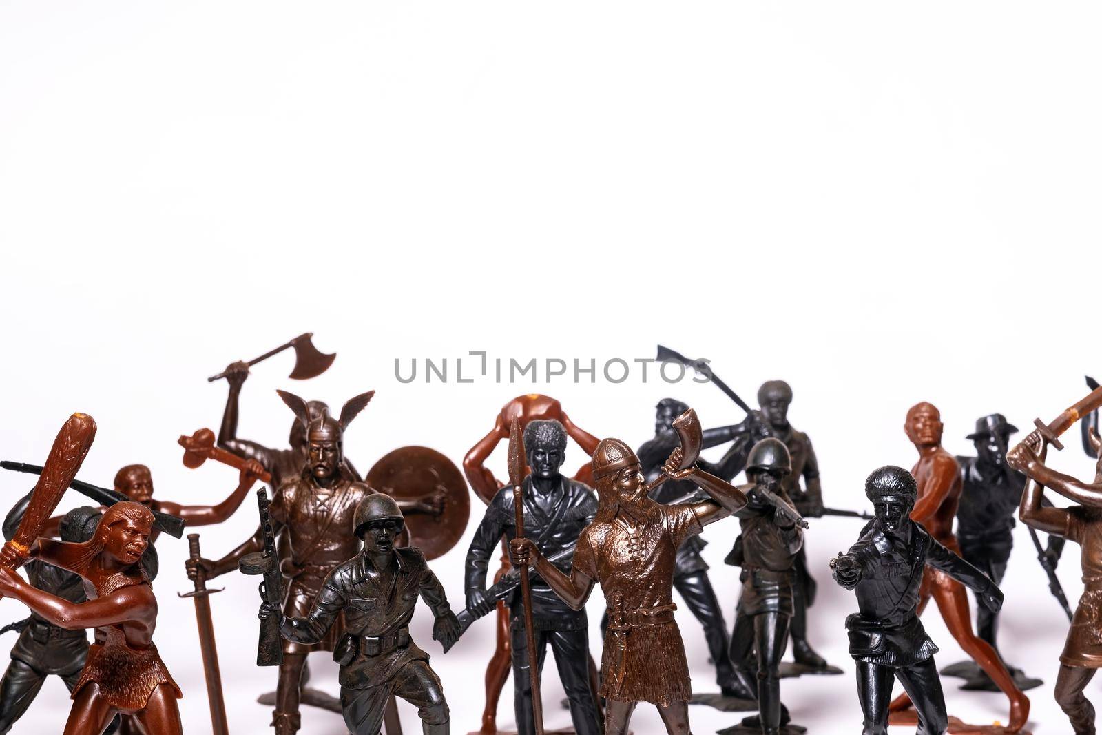 A set of different toy figures of soldiers on a white background.