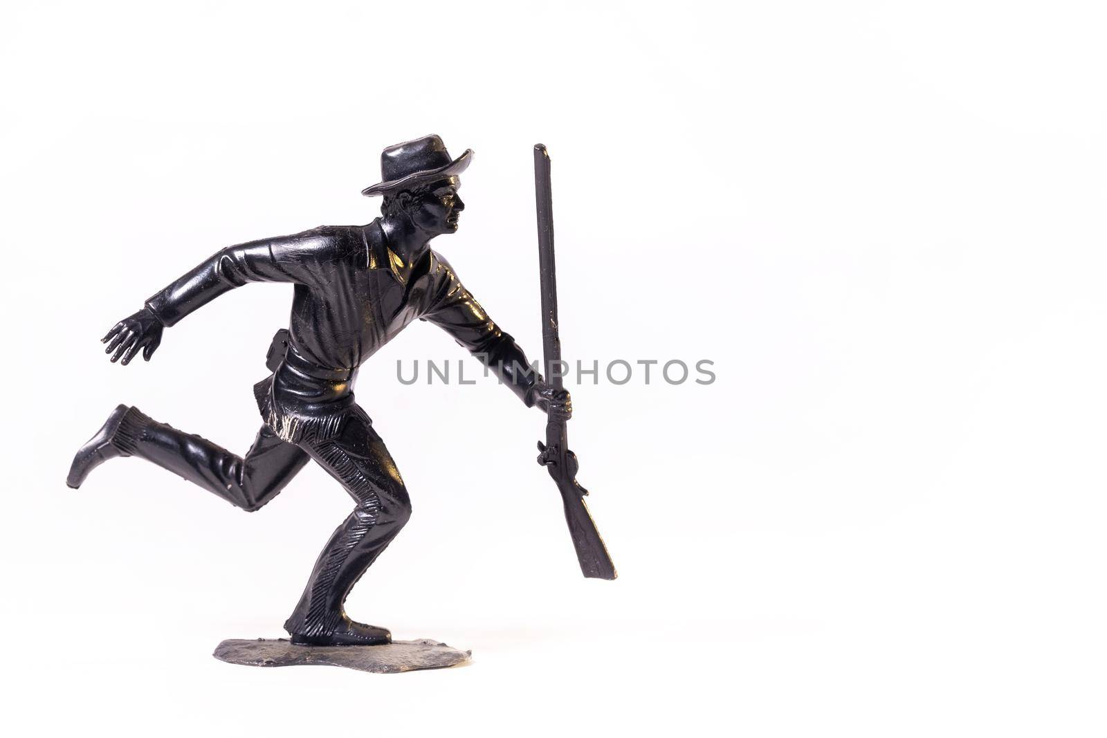 Vintage toy black soldier isolated on white background.